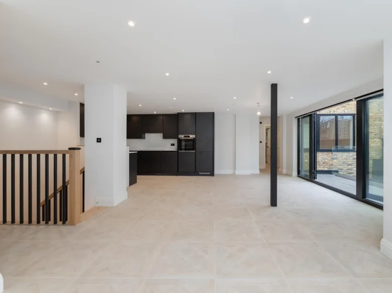 Spacious open-plan kitchen and living area with modern finishes for home refurbishment