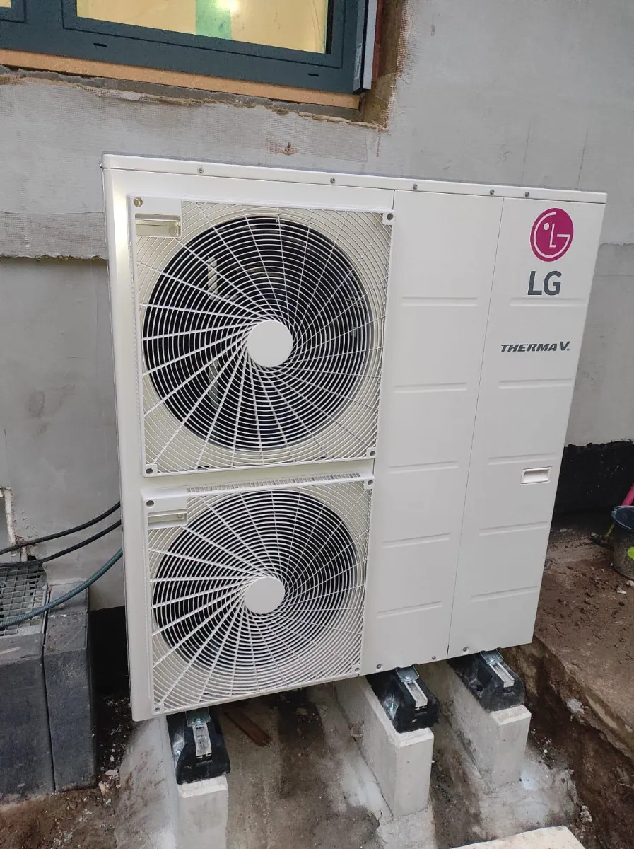 Installation of an LG air conditioning unit outside a building, showcasing HVAC services