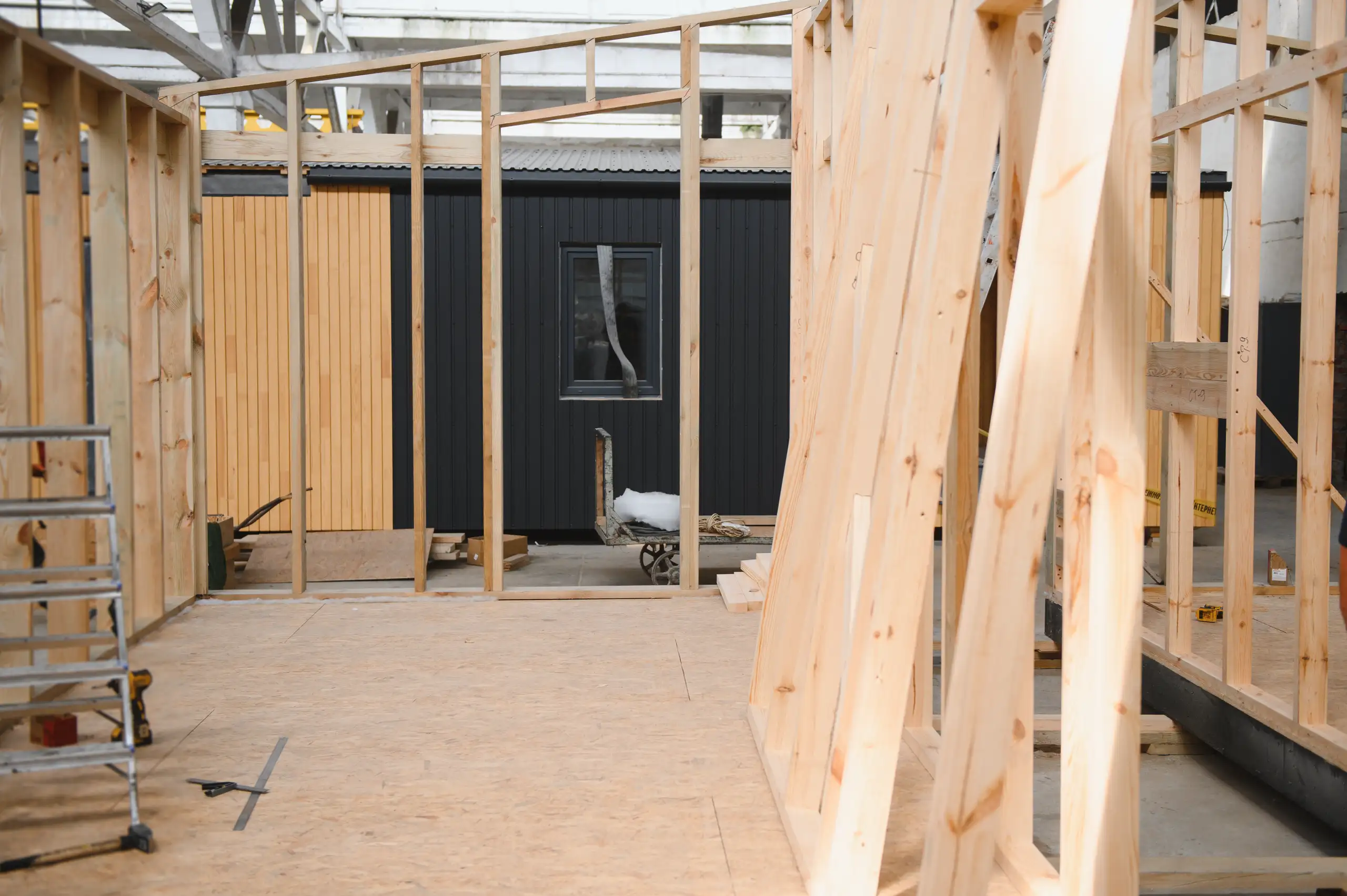 Interior view of a framed construction site during home refurbishment