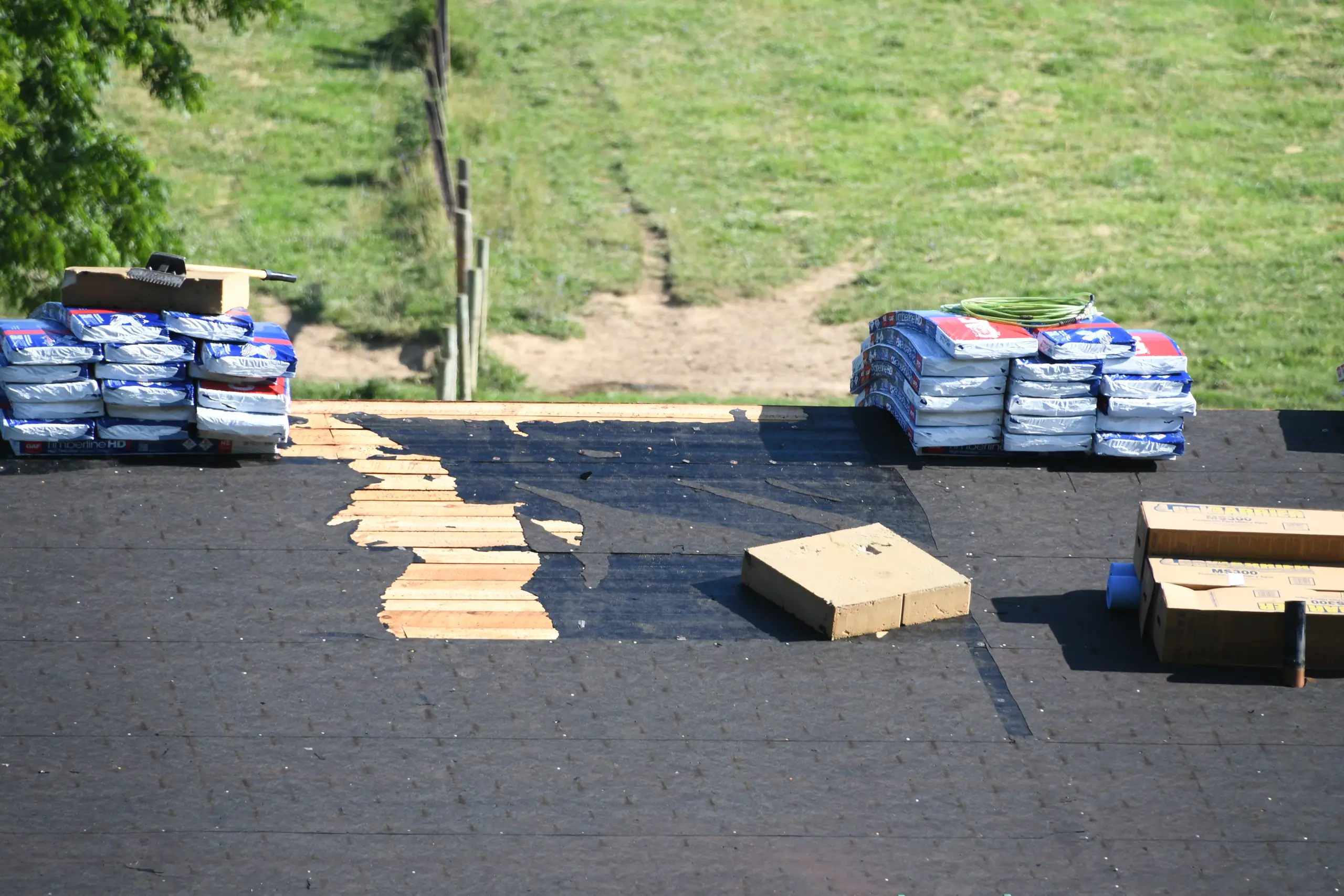 Roofing materials and equipment on a construction roof site ready for installation